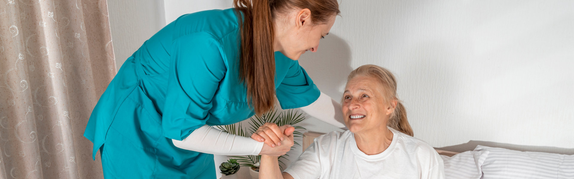 caregiver woman assisting a senior woman