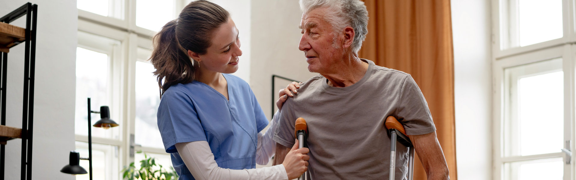 caregiver woman accompanying a senior man